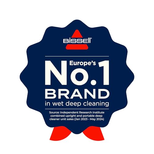 Genuine branded carpet washer with cleaning solution bottle alongside it